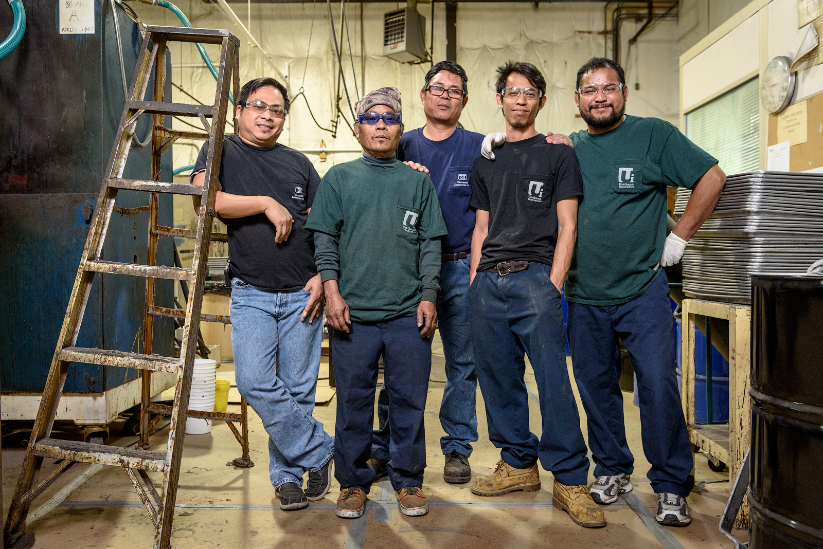 Posing for the camera — a few of our craftsmen who help keep our production floor humming.